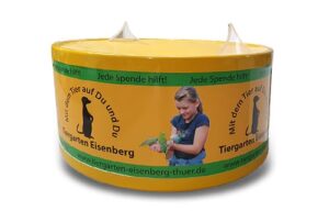 A yellow donation funnel with advertising print