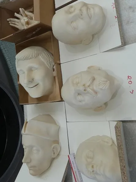 Faces of ghost train figures in 3D print